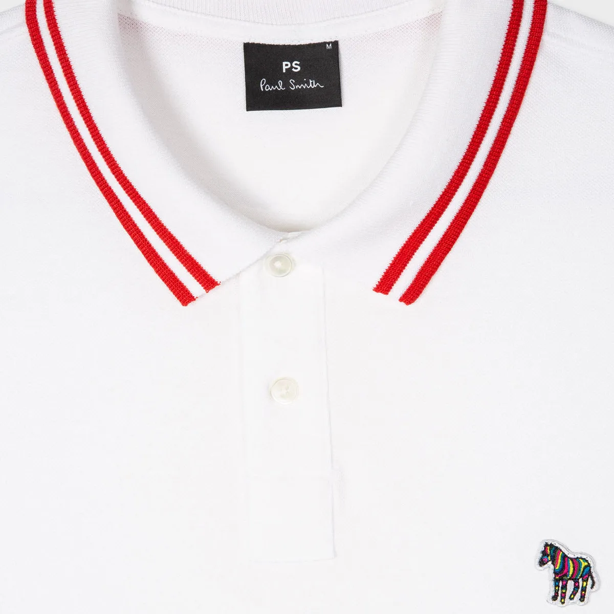 Paul Smith polo shirt with tipped zebra pattern in white.