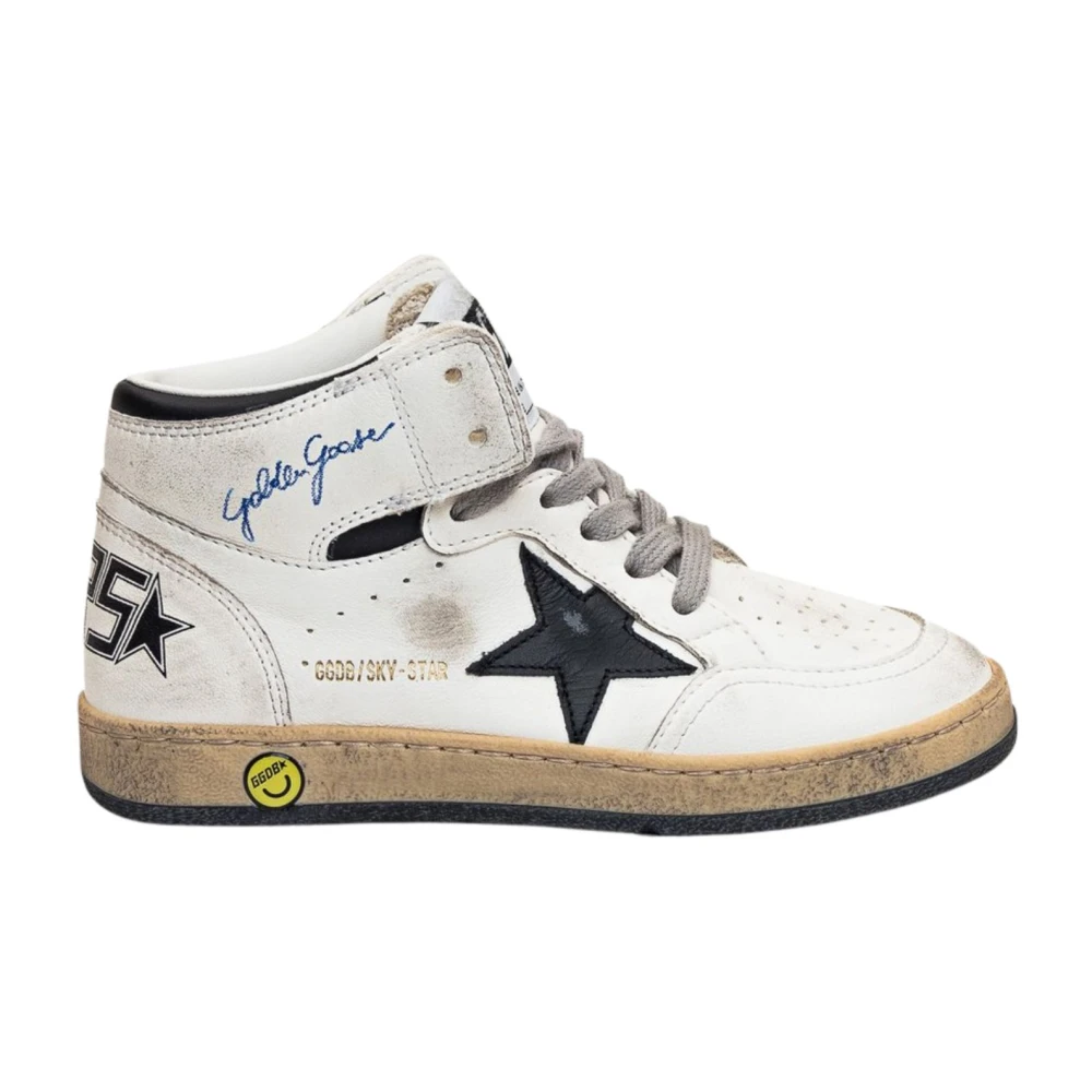 White leather sneakers with black star and blue logo.